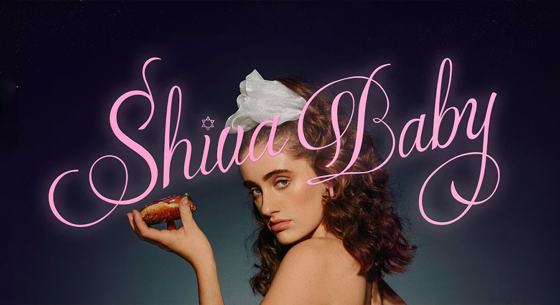Shiva Baby Official Poster: woman holding a donut
