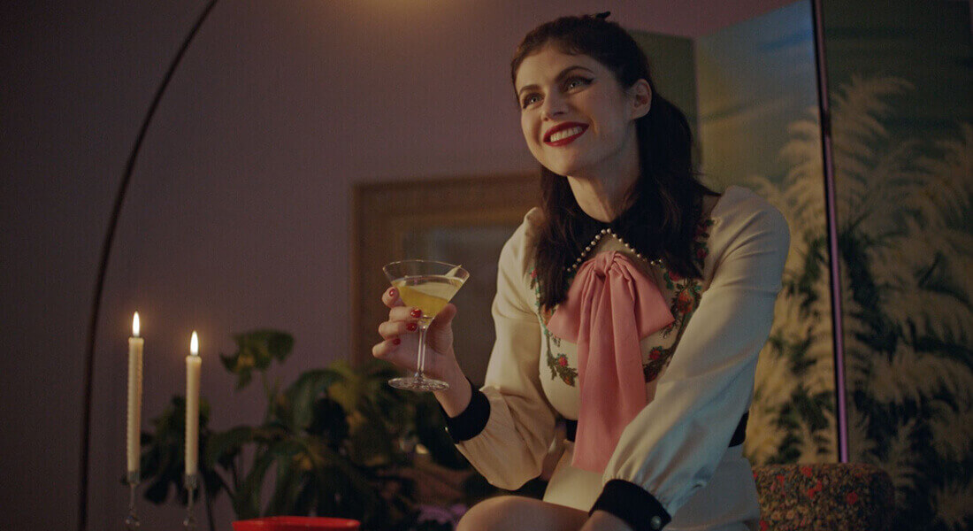 Alexandra Daddario holding a Grey Goose cocktail